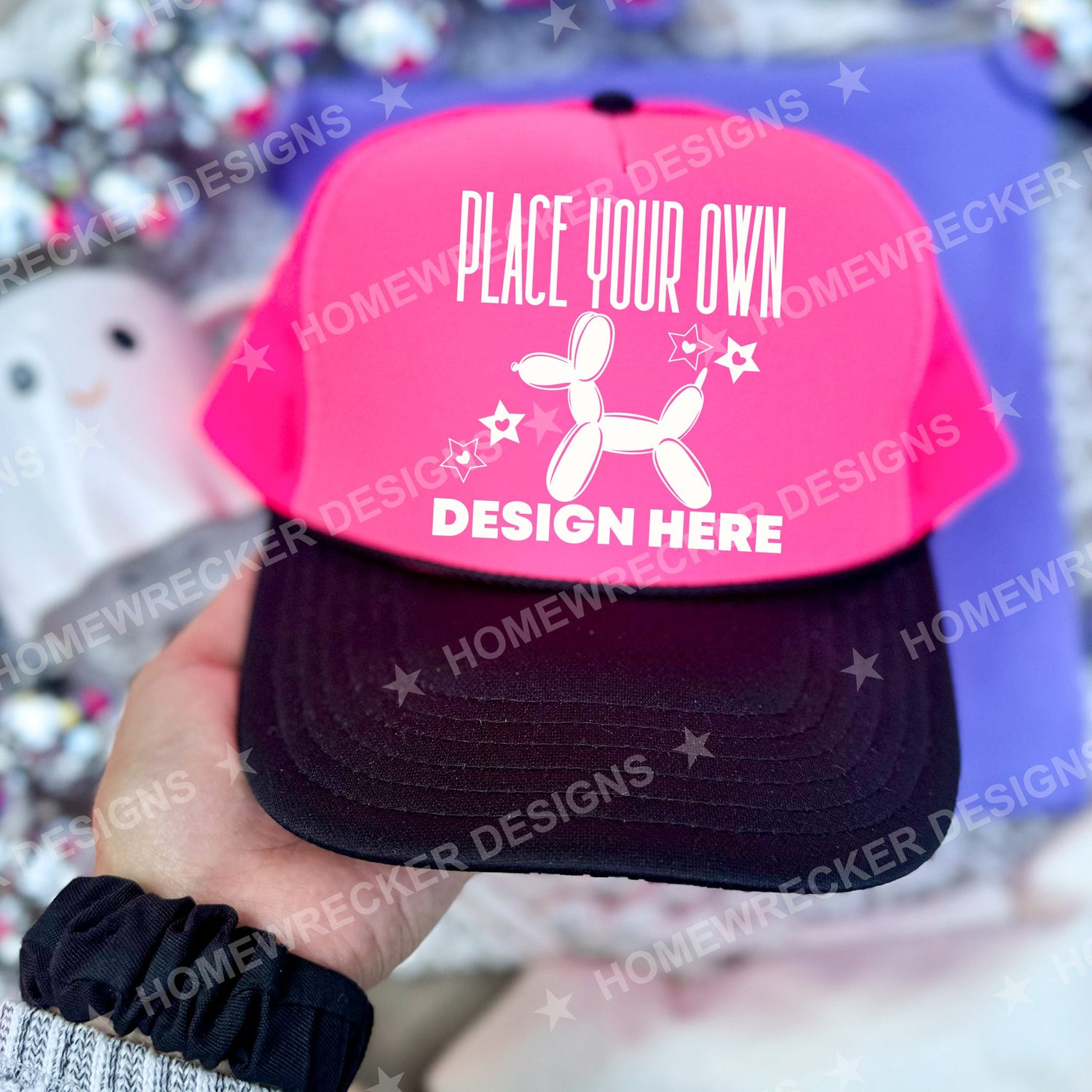 Blank Otto trucker hat in Neon Pink and Black, held mockup photo from Homewrecker Design Shop