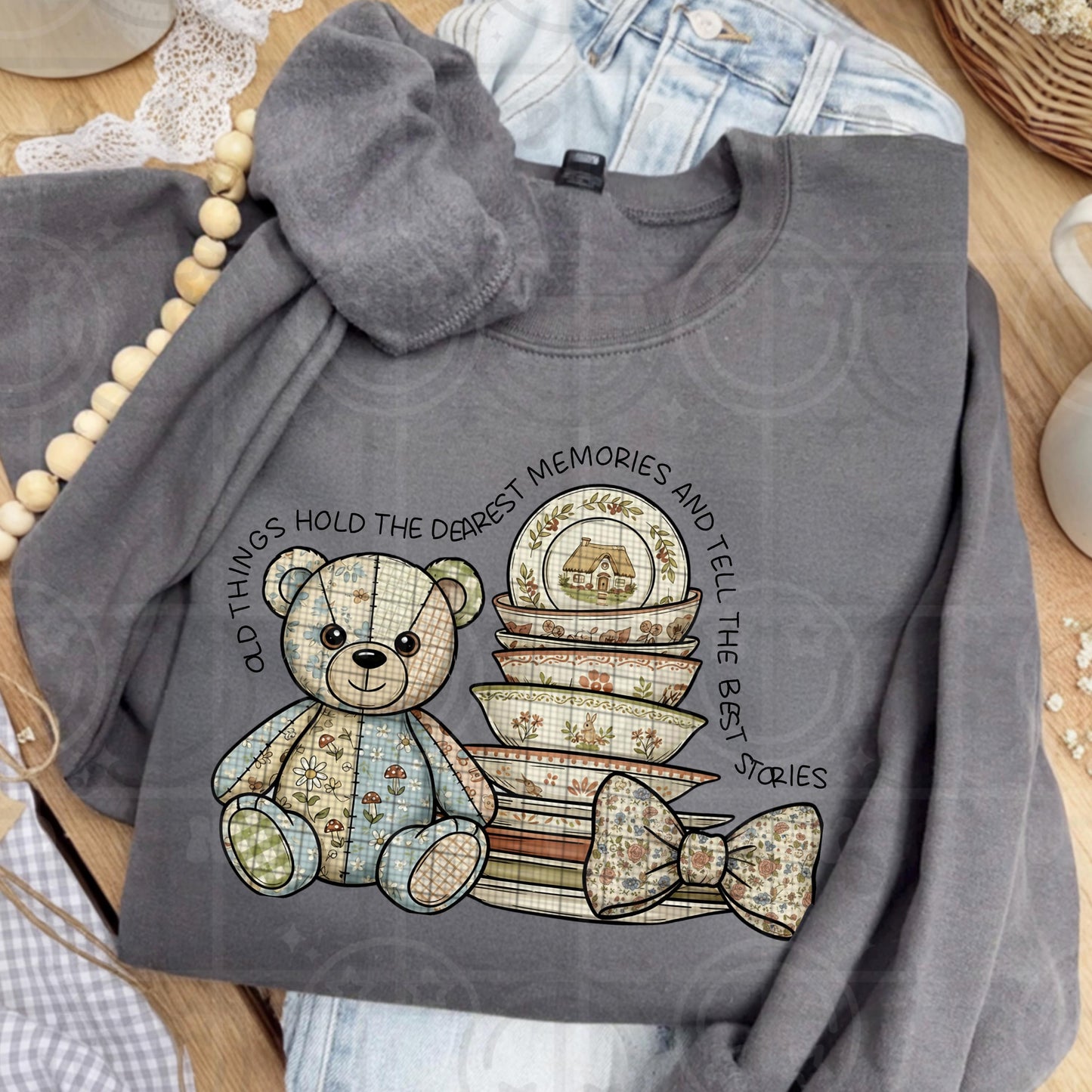 Grannycore style illustration of a patchwork teddy bear next to stacked vintage floral dishes with bows and cottagecore textures reading old things hold the dearest memories in a cozy shabby chic aesthetic