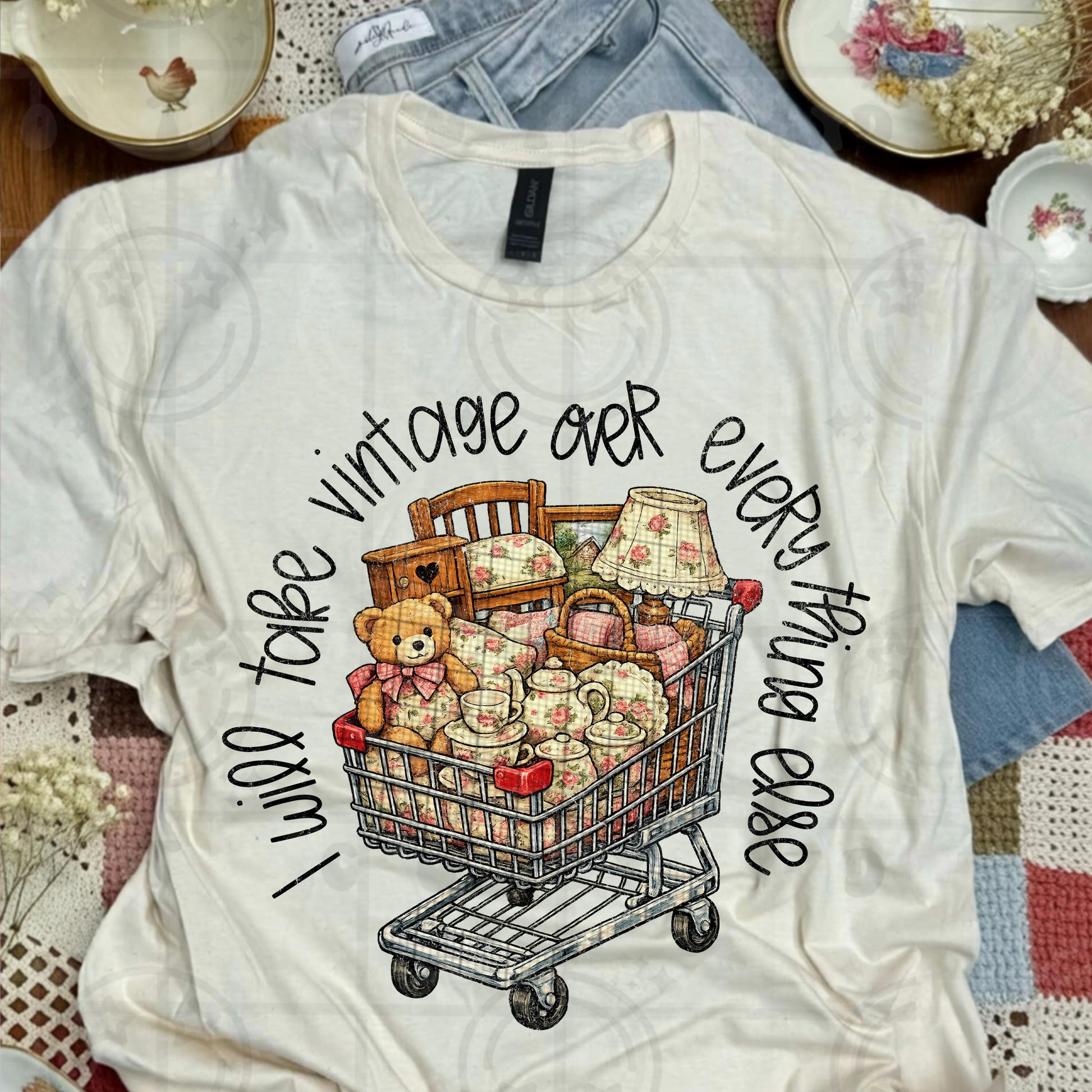 Grannycore distressed illustration of a vintage shopping cart filled with floral dishes teddy bear lamp and antique furniture with text I will take vintage over everything else in shabby chic cottagecore style
