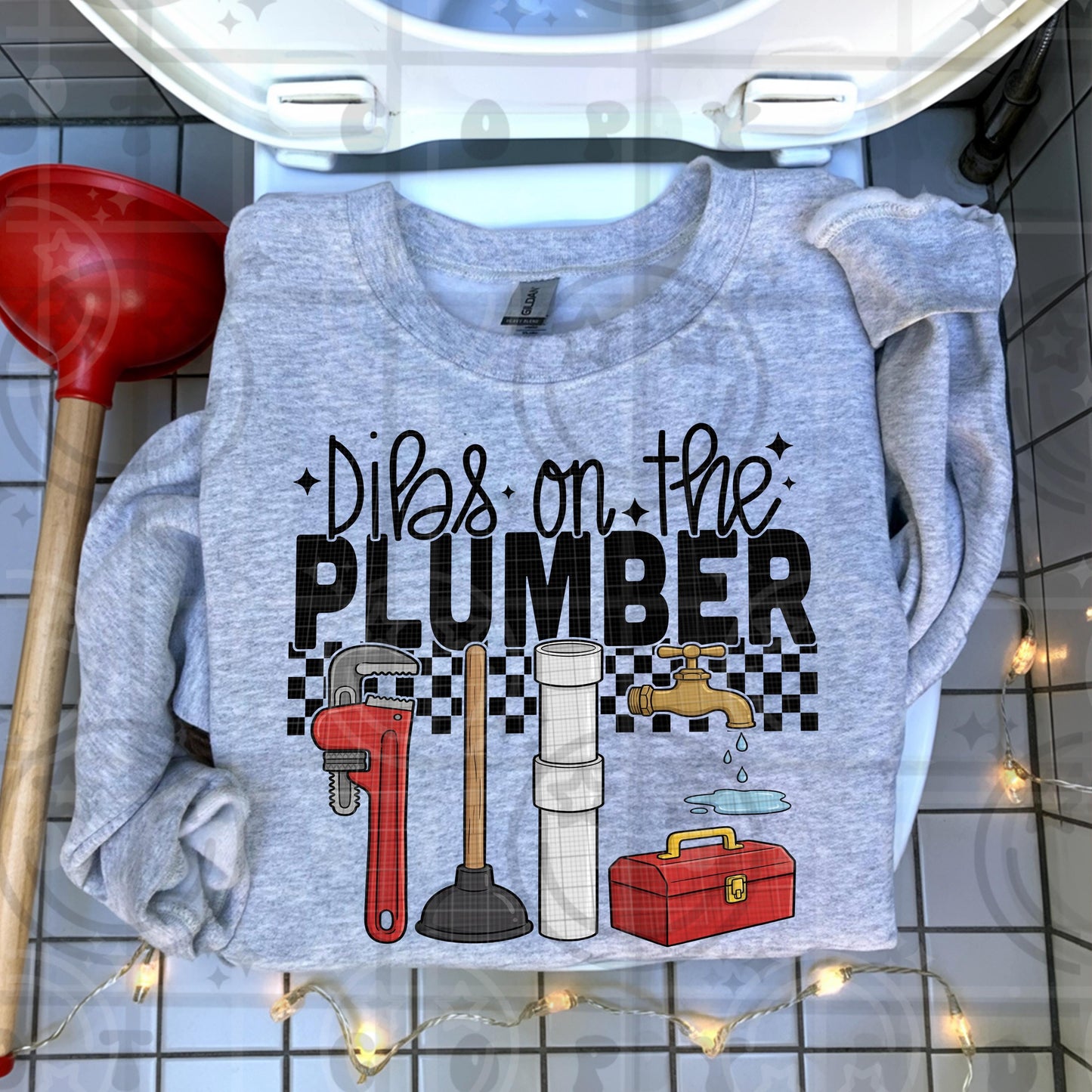 Funny plumber themed illustration with pipe wrench plunger pipe fittings toolbox dripping faucet and bold text reading dibs on the plumber