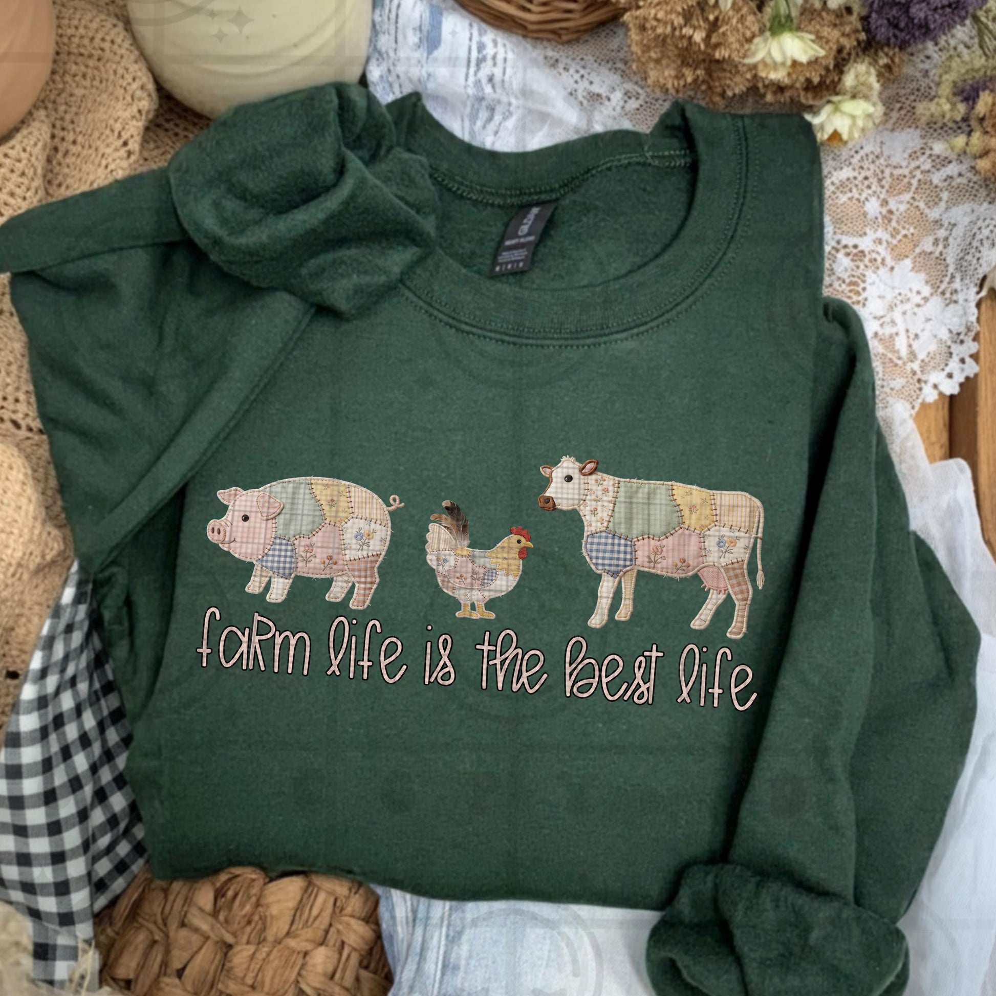 Farmhouse faux embroidery style design with patchwork pig chicken and cow and stitched text reading Farm life is the best life in rustic country colors
