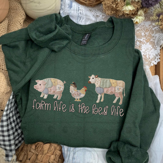Farmhouse faux embroidery style design with patchwork pig chicken and cow and stitched text reading Farm life is the best life in rustic country colors